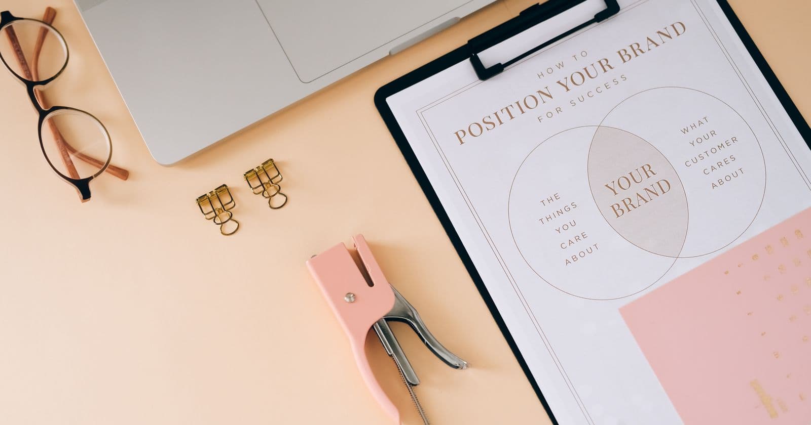 Brand positioning worksheet on a desk flat lay