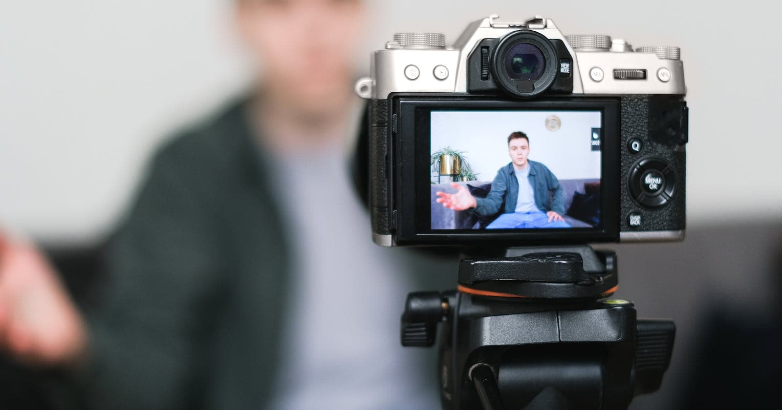 Camera on a tripod filming a content creator