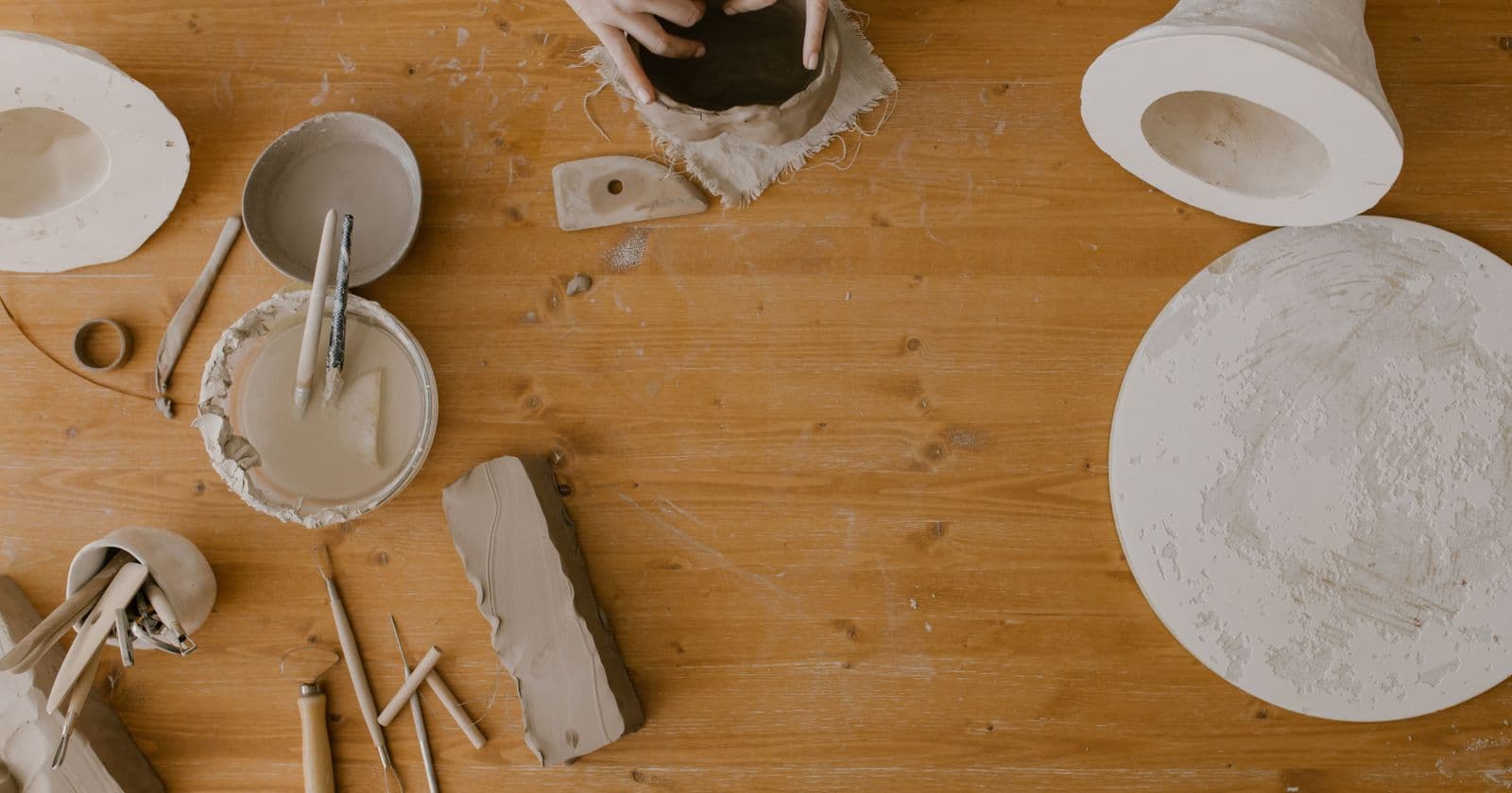 Pottery workspace with clay and tools