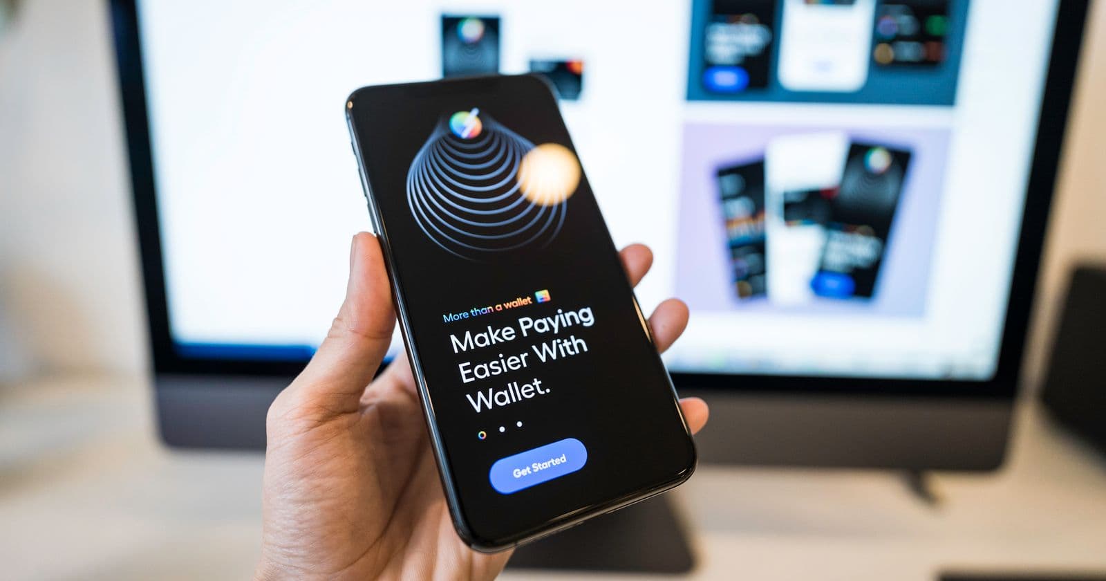 Hand holding a phone with a digital wallet app