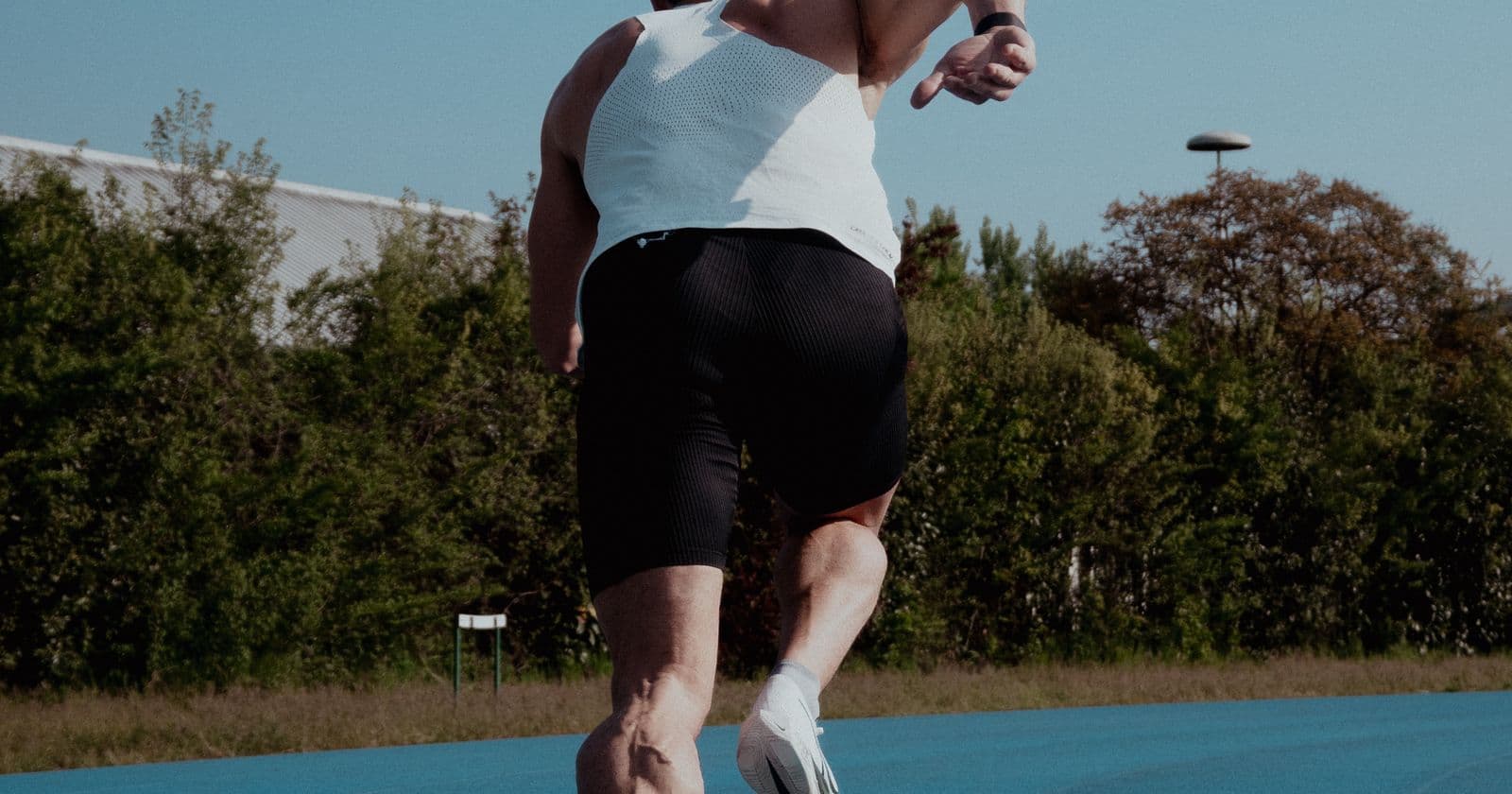 Athlete running on an outdoor track