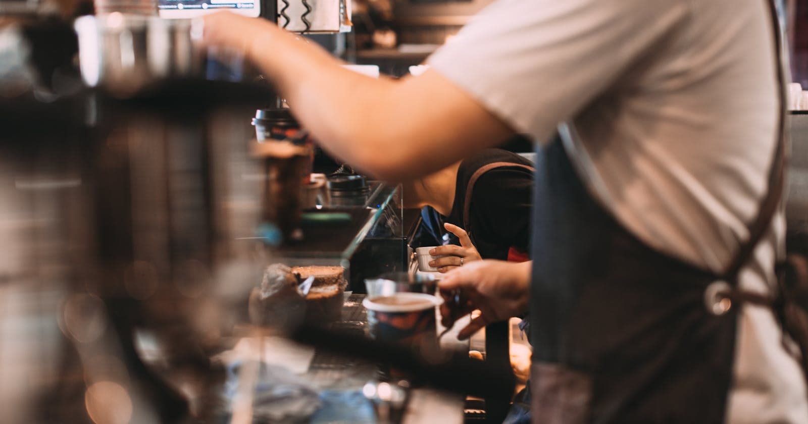 Barista preparing coffee at an espresso machine