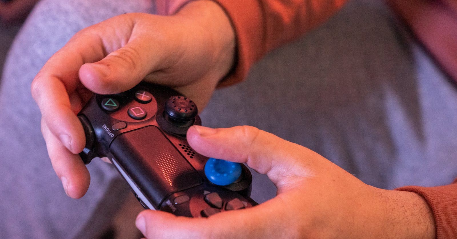 Hands gripping a game controller