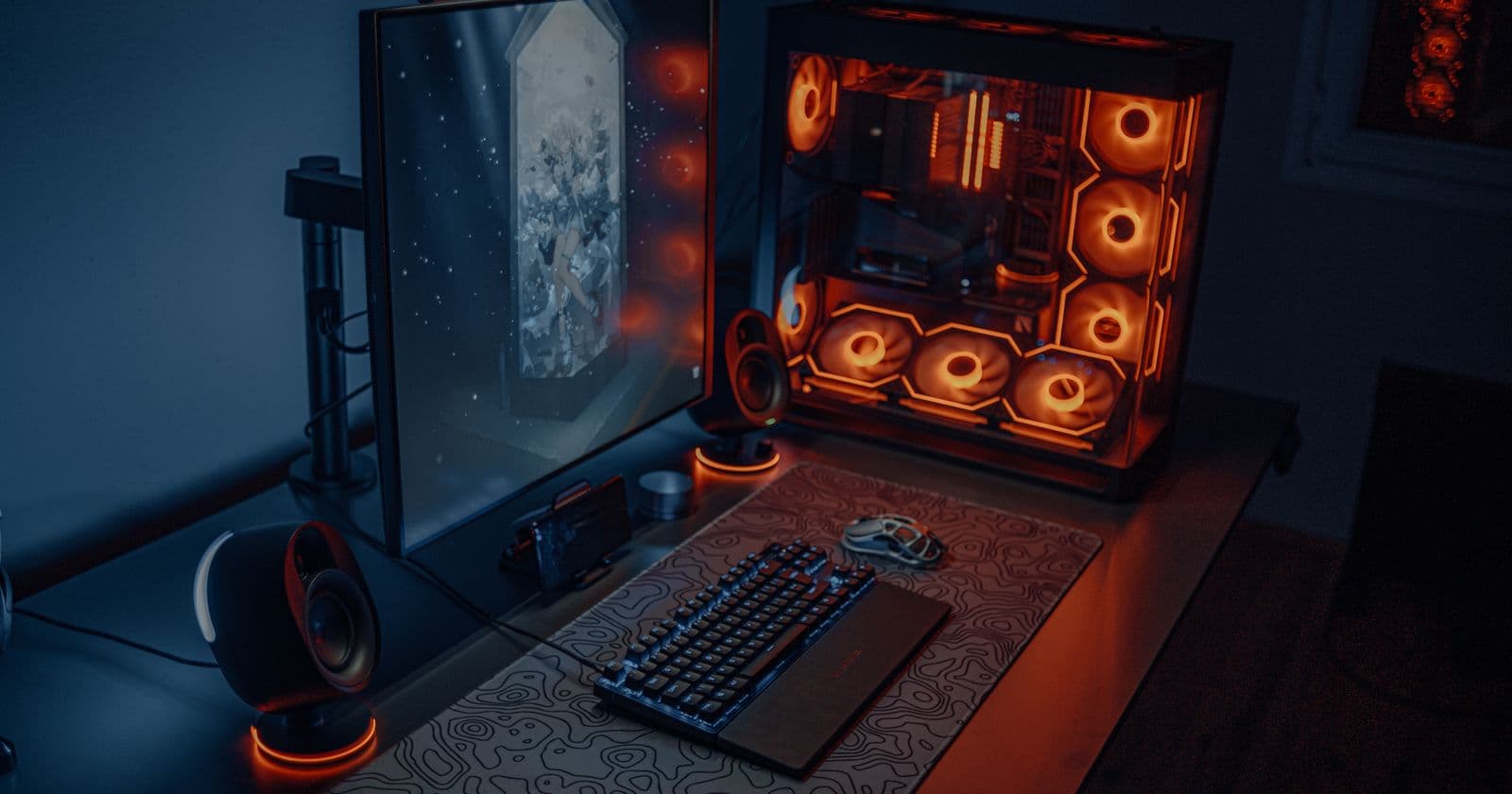Gaming PC with RGB lighting and a keyboard setup