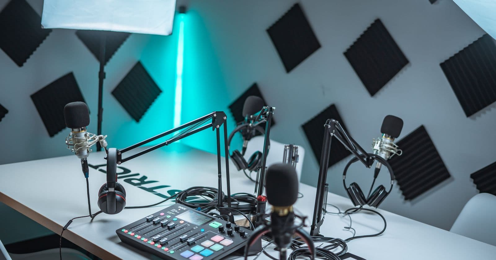 Podcast studio with microphones and a mixer