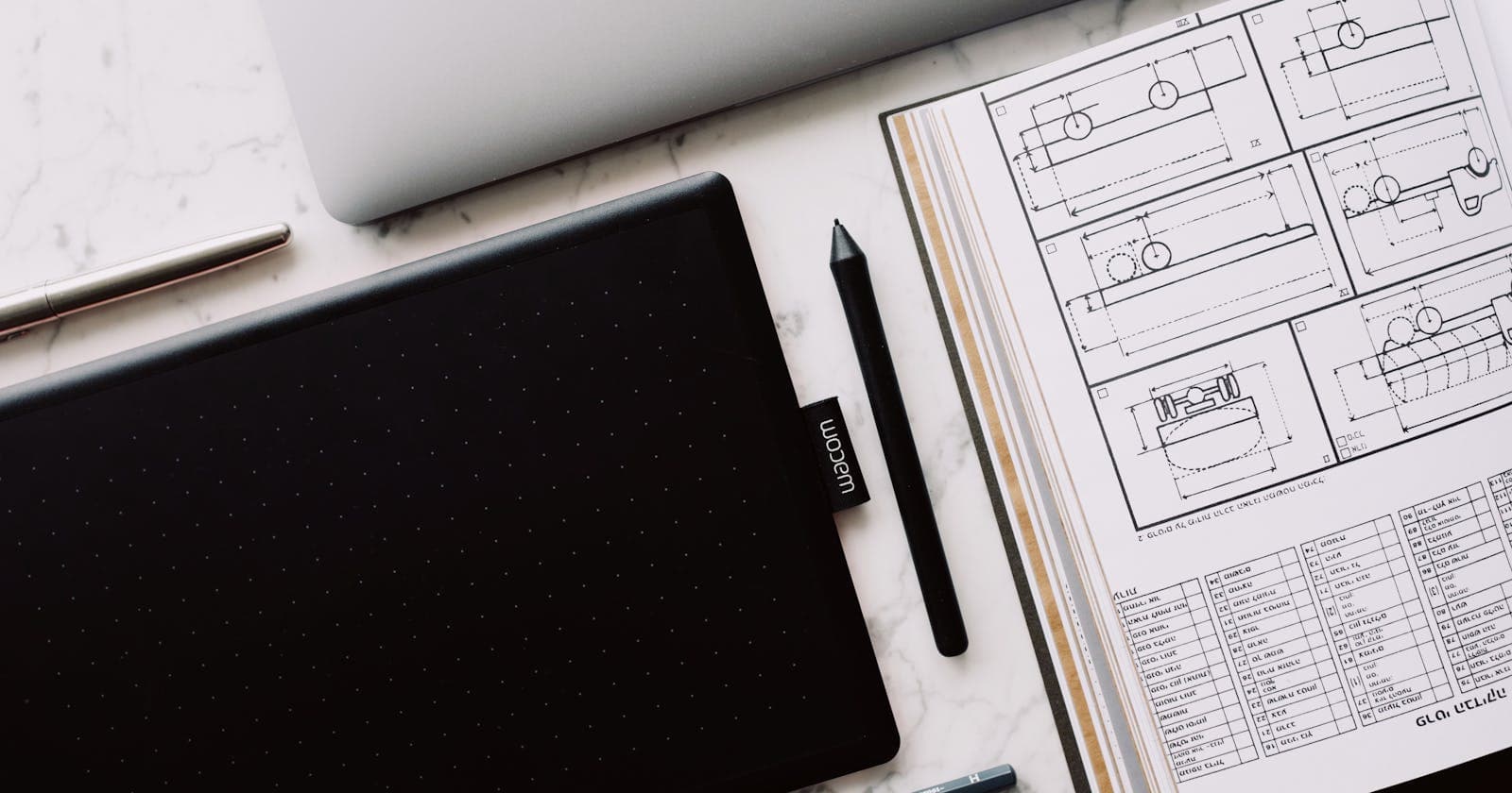 Design tablet and sketches on a desk