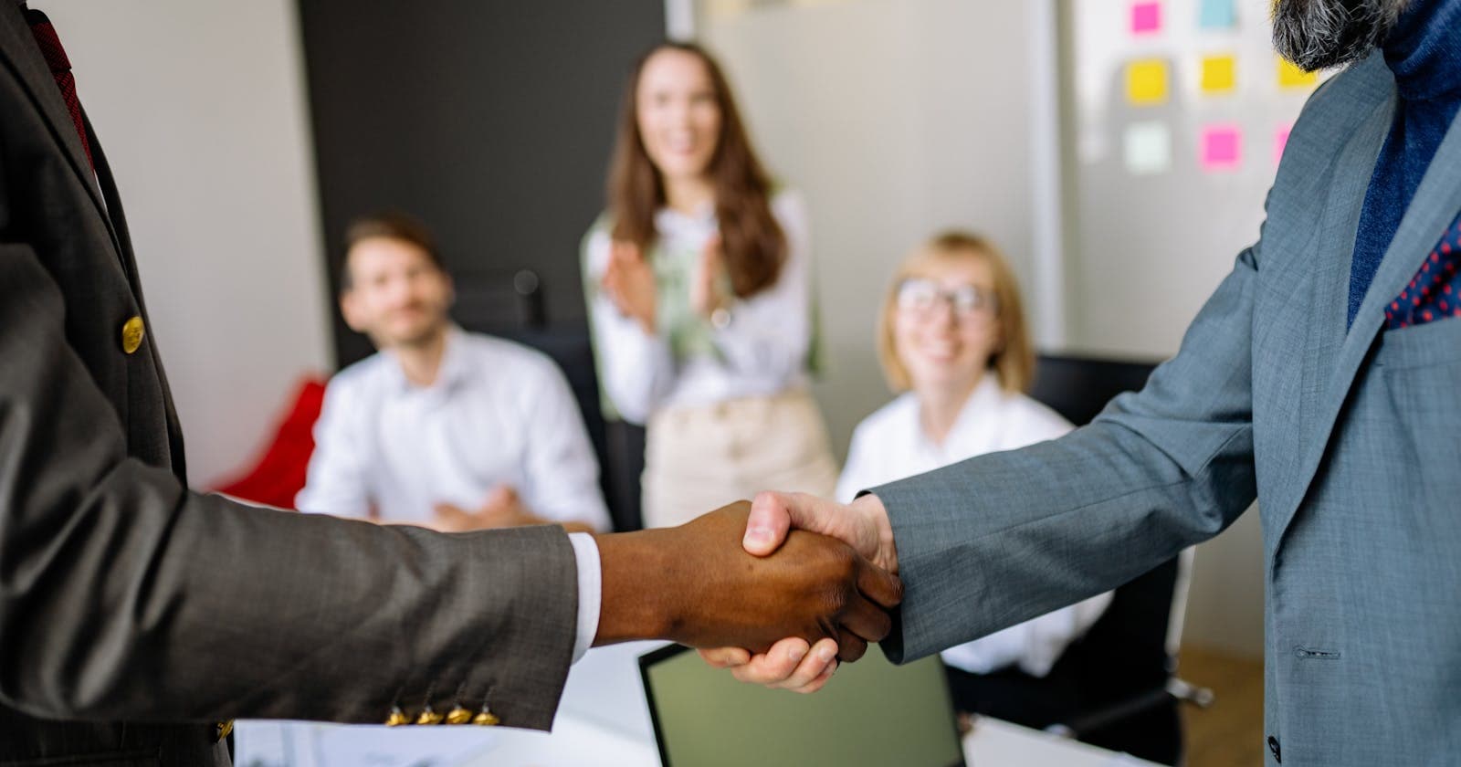 Professionals shaking hands in a business meeting