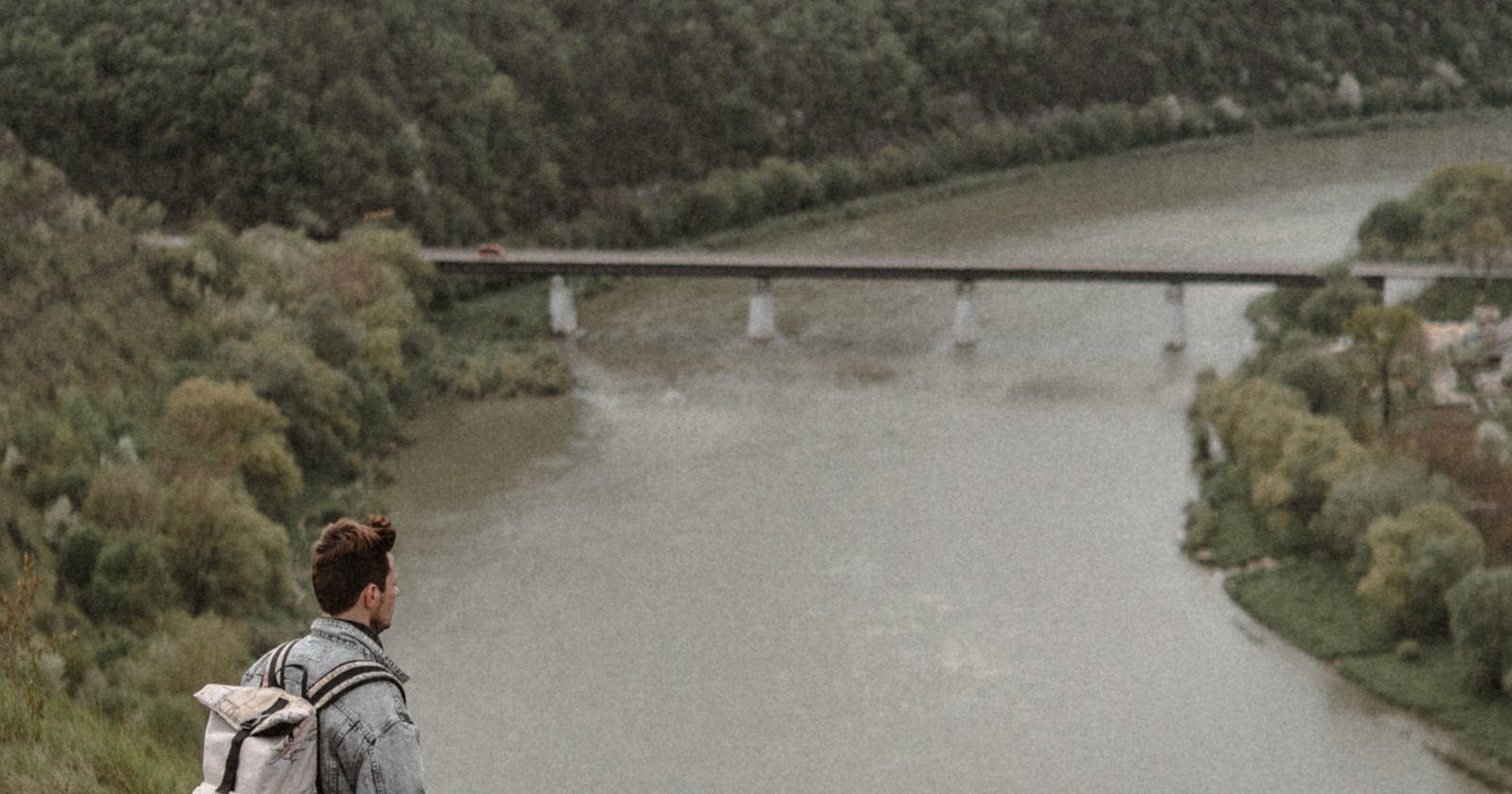Traveler with a backpack at a scenic viewpoint