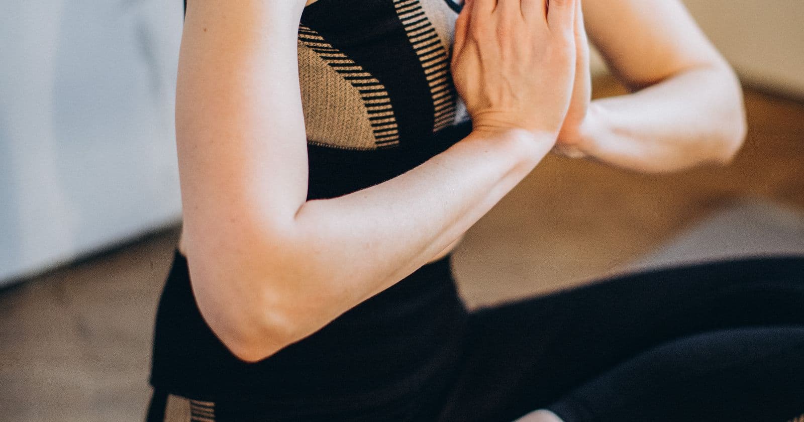 Person in a yoga pose on a mat