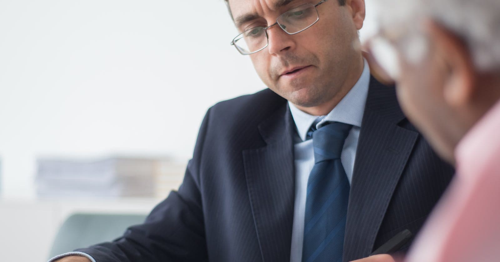Consultant reviewing documents with a client